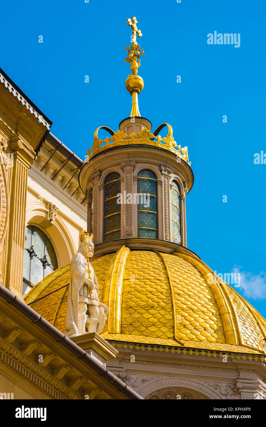 Krakow Cathedral, view of gilt lantern dome and apostle statue above the Zygmunt Chapel on the exterior of the Cathedral on Wawel Hill, Krakow Stock Photo