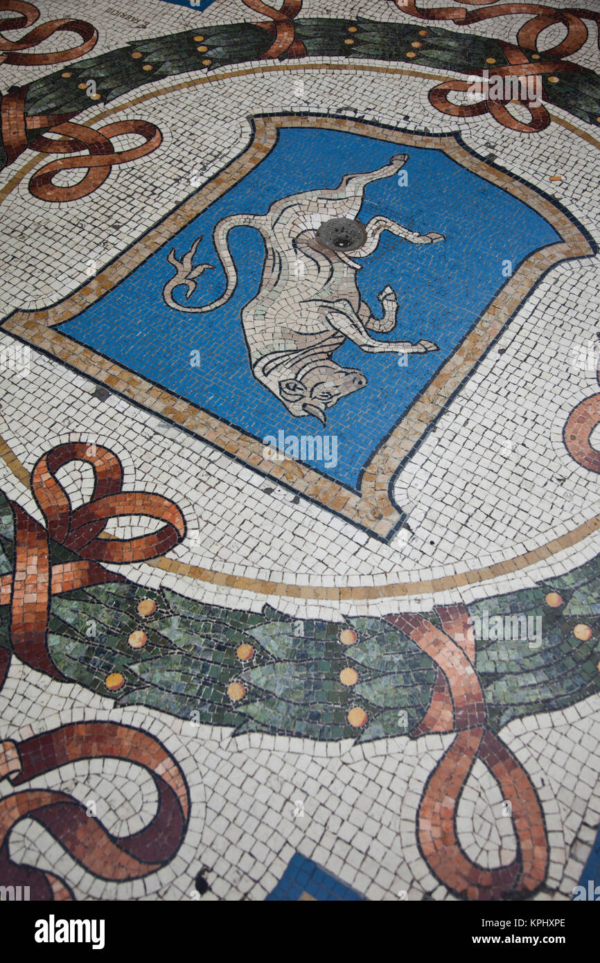 Italy, Milan Province, Milan. Galleria Vittorio Emanuele II shopping arcade, mosaic bull (good luck charm). Stock Photo