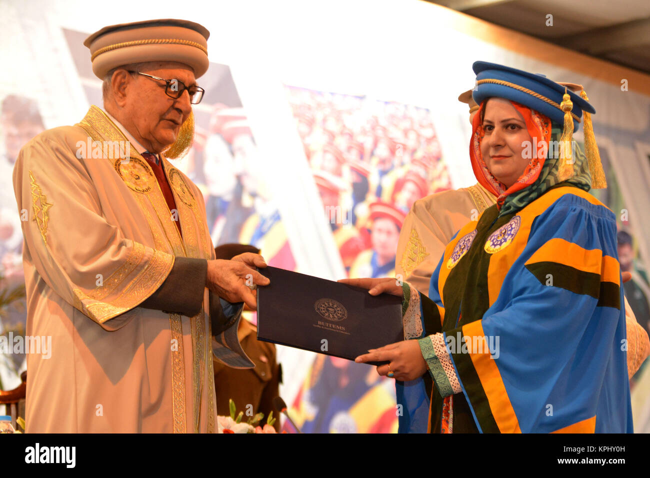 QUETTA, PAKISTAN. Dec-14 2017: Chancellor and Governor of Balochistan Mr. Muhammad Khan Achakzai awarding doctorate degree to PHD holders during cerem Stock Photo