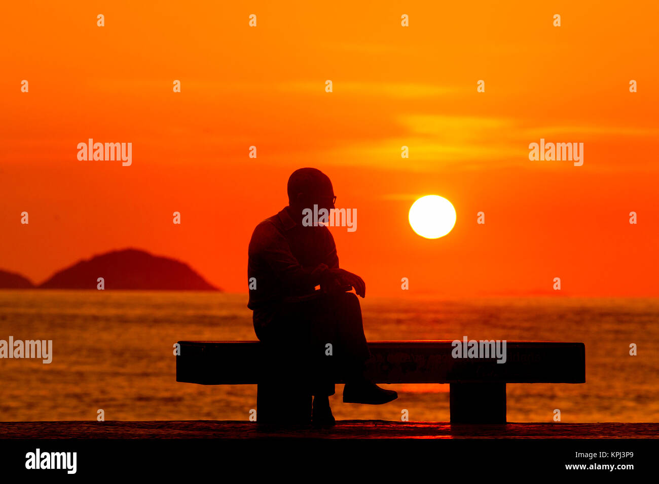 Statue of late poet Carlos Drummond de Andrade early morning at Copacabana beach, Rio de Janeiro, Brazil Stock Photo