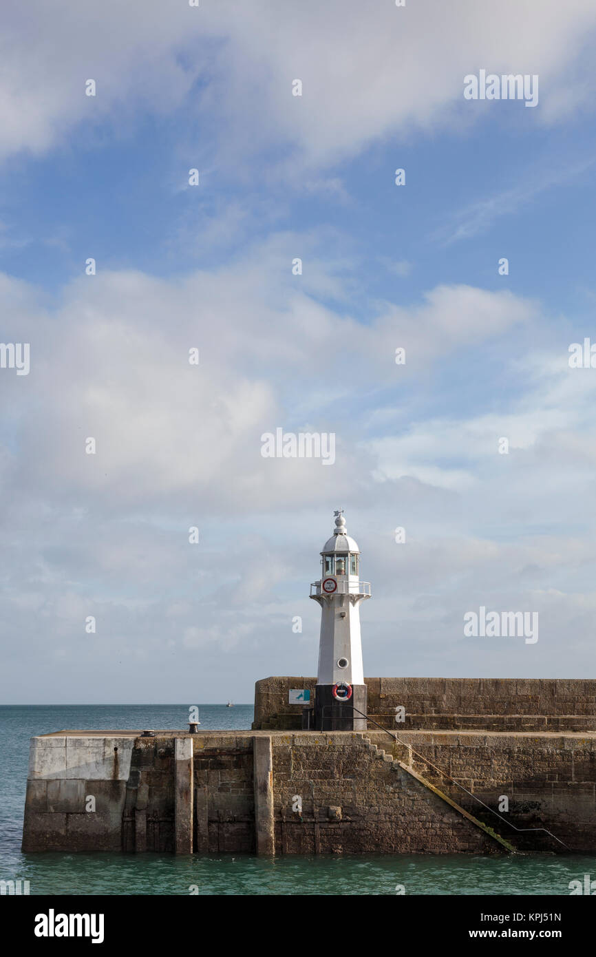 The Mevagissey lighthouse on the south breakwater is 8 metres high and was constructed in 1896. Stock Photo