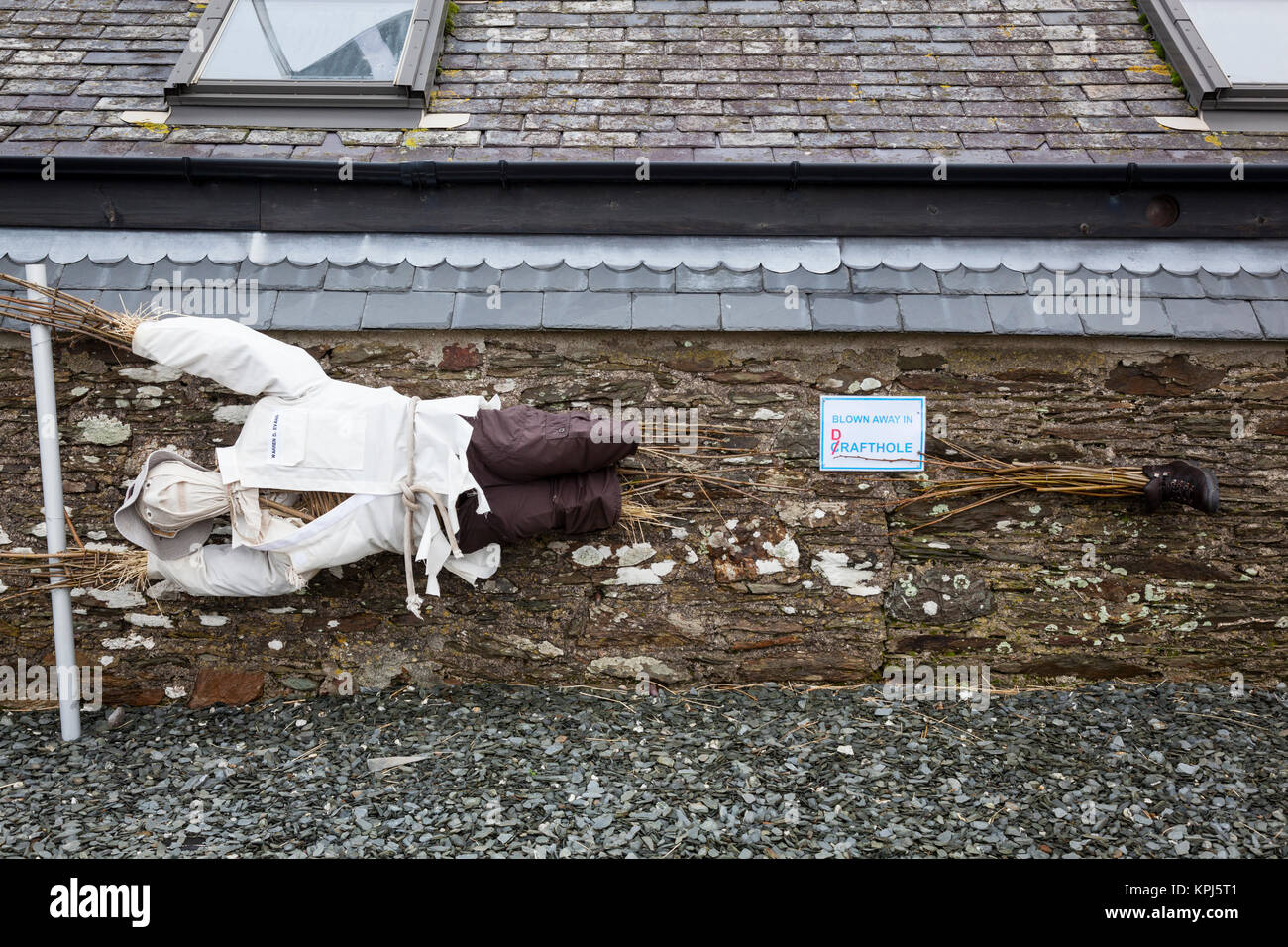 Fun dummy pretending to be blown away by wind Stock Photo Alamy