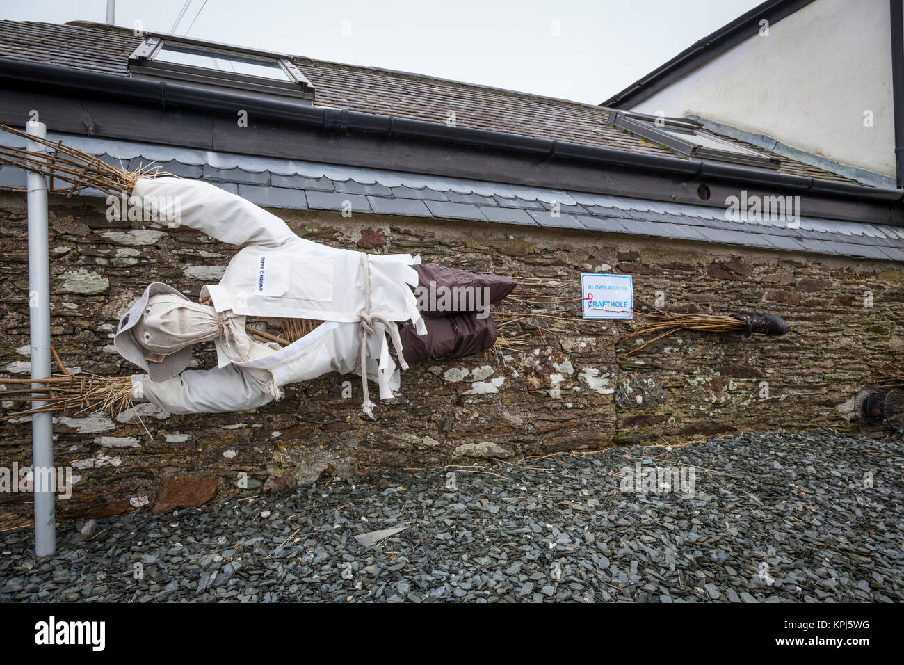 Fun dummy pretending to be blown away by wind Stock Photo Alamy