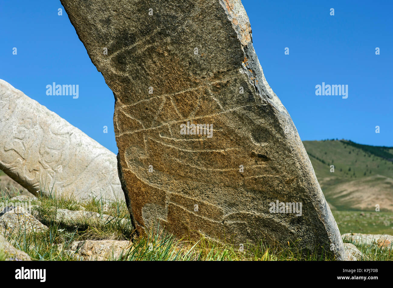 Stone stele with engravings, called deer stone, tombstone from the late Bronze Age, Khangai Nuruu National Park Stock Photo