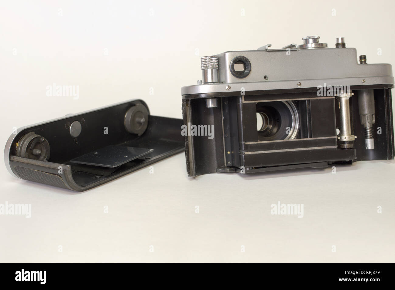partially disassembled a vintage camera with opened shutter curtain