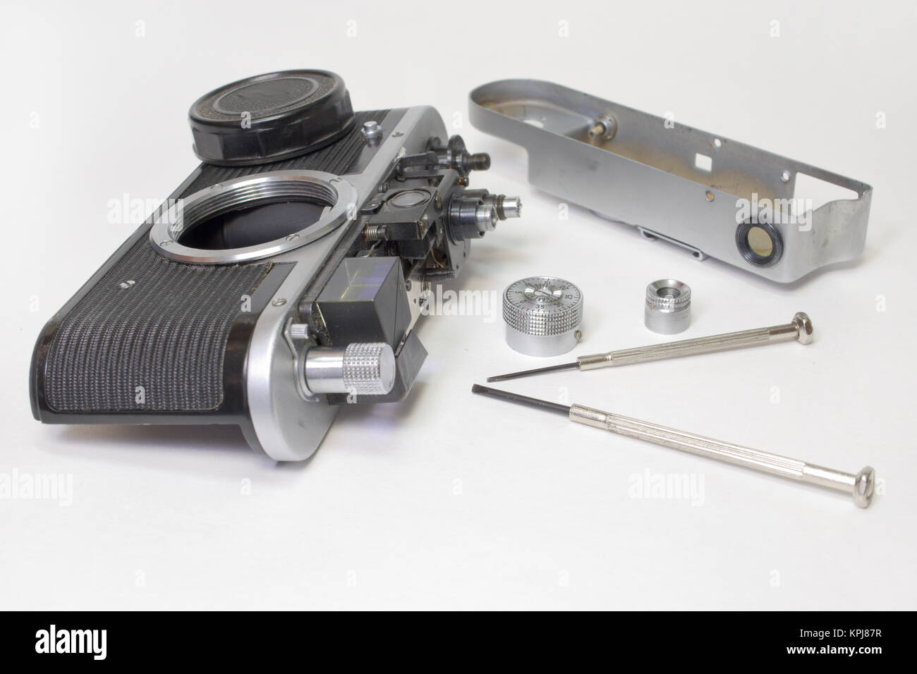 vintage film camera, disassembled for inspection of rangefinder