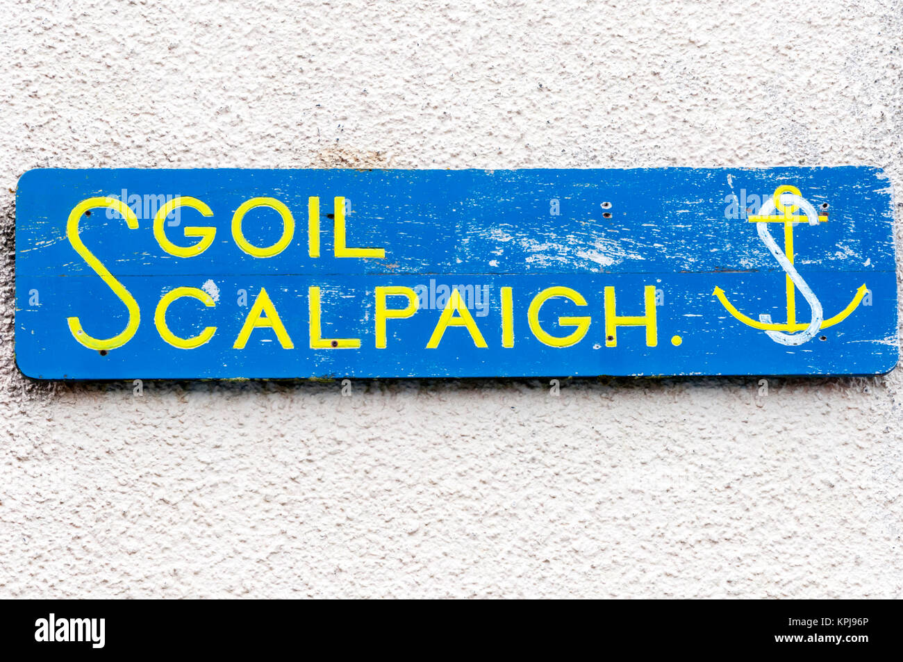 A sign with the Gaelic name for Scalpay School on the island of Scalpay in the Outer Hebrides. Stock Photo