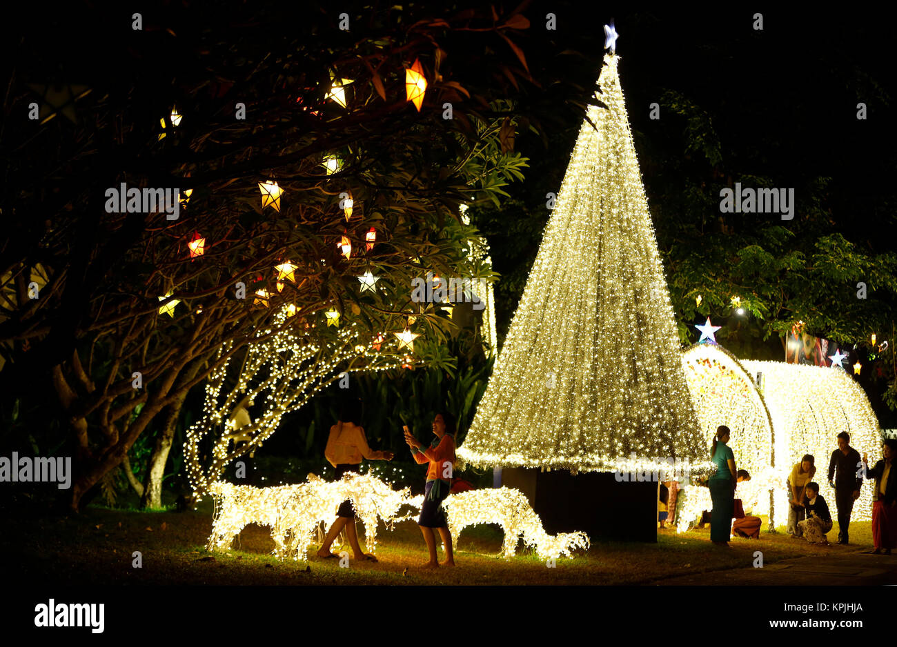 Yangon, Myanmar. 16th Dec, 2017. People walk among decorations of