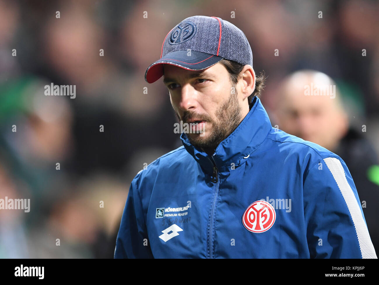 Mainz' coach Sandro Schwartz leaves the pitch during the break of the German Bundesliga soccer match between Werder Bremen and 1. FSV Mainz 05 in the Weserstadion in Bremen, Germany, 16 December 2017. Junuzovic is not able to play due to an injury.    (EMBARGO CONDITIONS - ATTENTION: Due to the accreditation guidelines, the DFL only permits the publication and utilisation of up to 15 pictures per match on the internet and in online media during the match.) Photo: Carmen Jaspersen/dpa Stock Photo