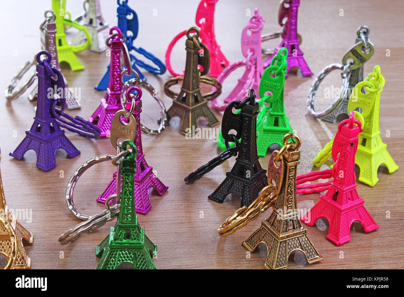 Eiffel tower statue. Paris tourism illustration. Beautiful metallic plastic souvenir statue. Colorful illustration of french tourism or any other conc Stock Photo
