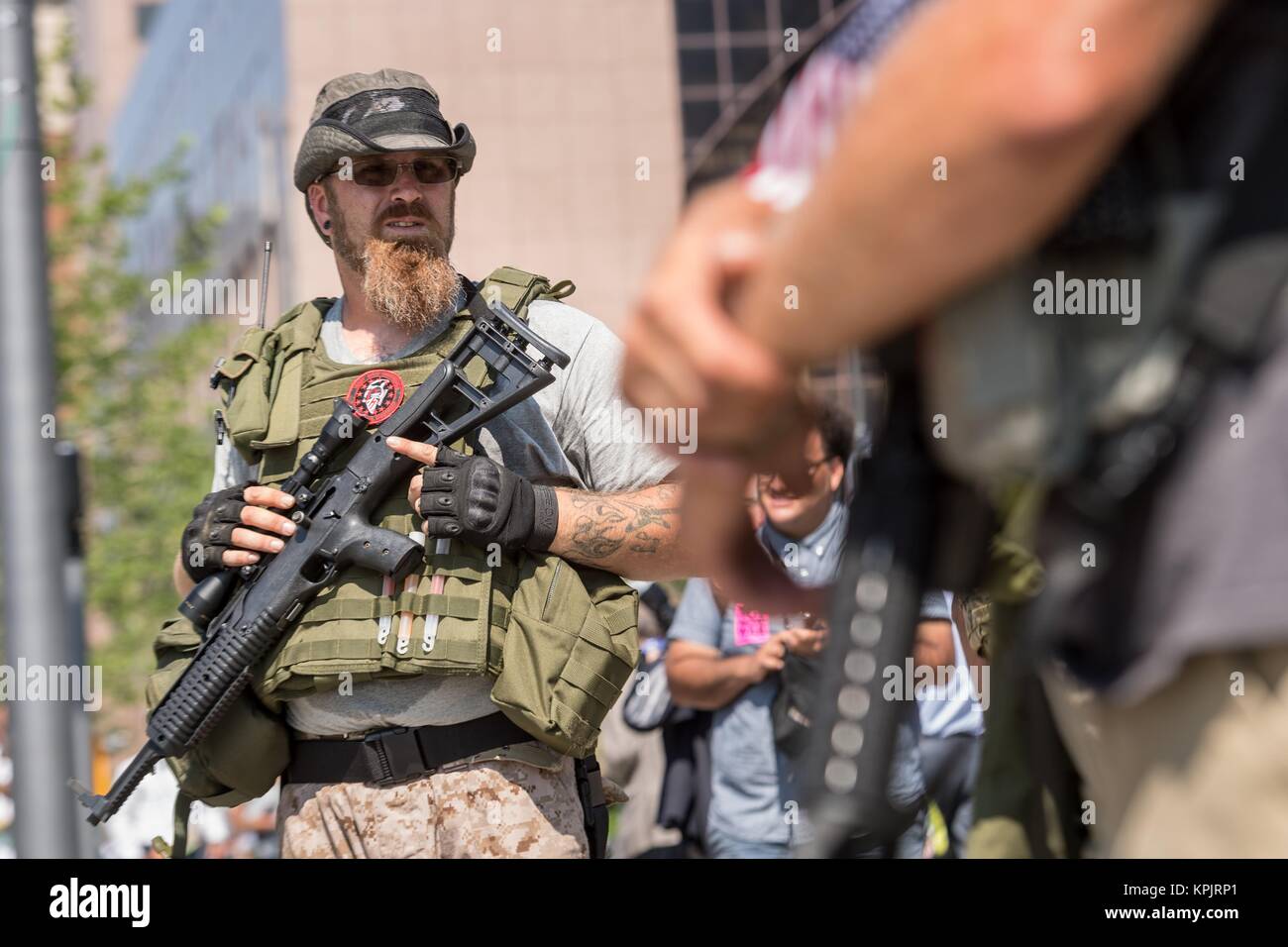 Members of an Ohio militia group protest by openly carrying military style semi-automatic weapons downtown near the Republican National Convention July 19, 2016 in Cleveland, Ohio. Stock Photo