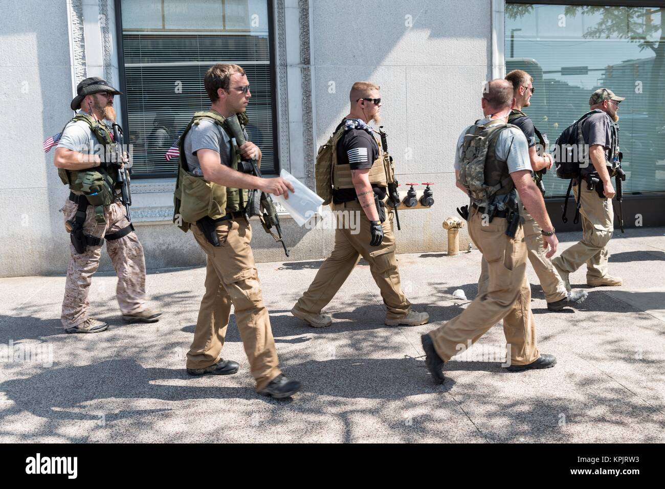 Members of an Ohio militia group protest by openly carrying military style semi-automatic weapons downtown near the Republican National Convention July 19, 2016 in Cleveland, Ohio. Stock Photo