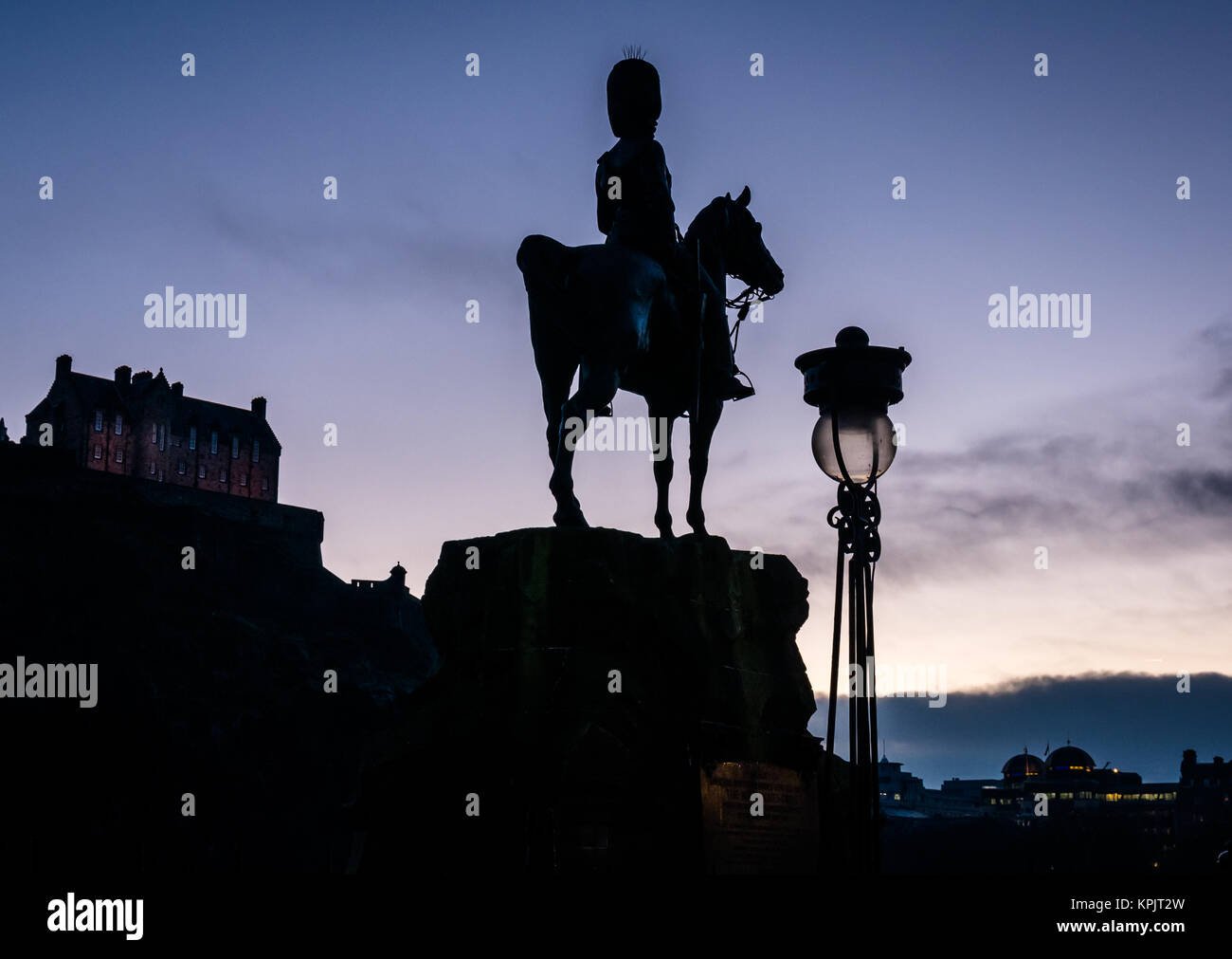Silhouette Royal Scots Greys Monument soldier on horseback by William Birnie Rhind, Edinburgh Castle, Princes Street, Edinburgh, Scotland, UK at dusk Stock Photo