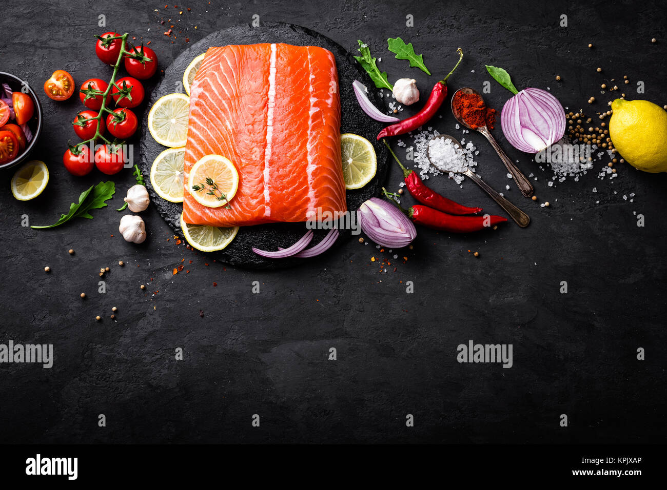 Fresh raw salmon red fish fillet on black background. Top view Stock ...