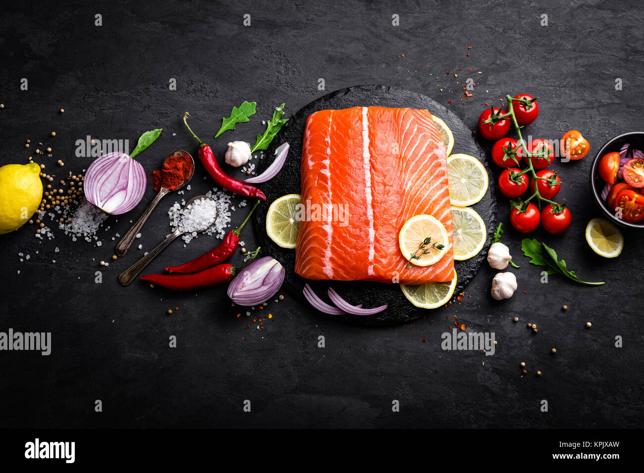 Fresh raw salmon red fish fillet on black background. Top view Stock ...