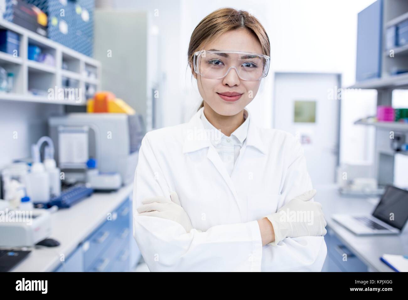 Female laboratory assistant with arms folded, portrait. Stock Photo