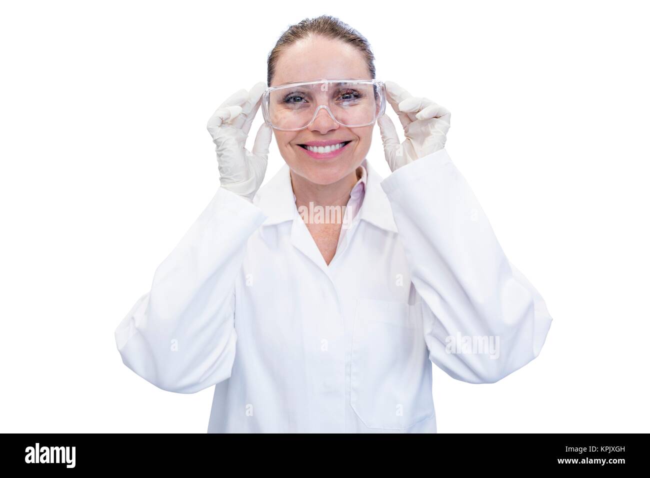 Female laboratory assistant adjusting safety goggles, portrait. Stock Photo