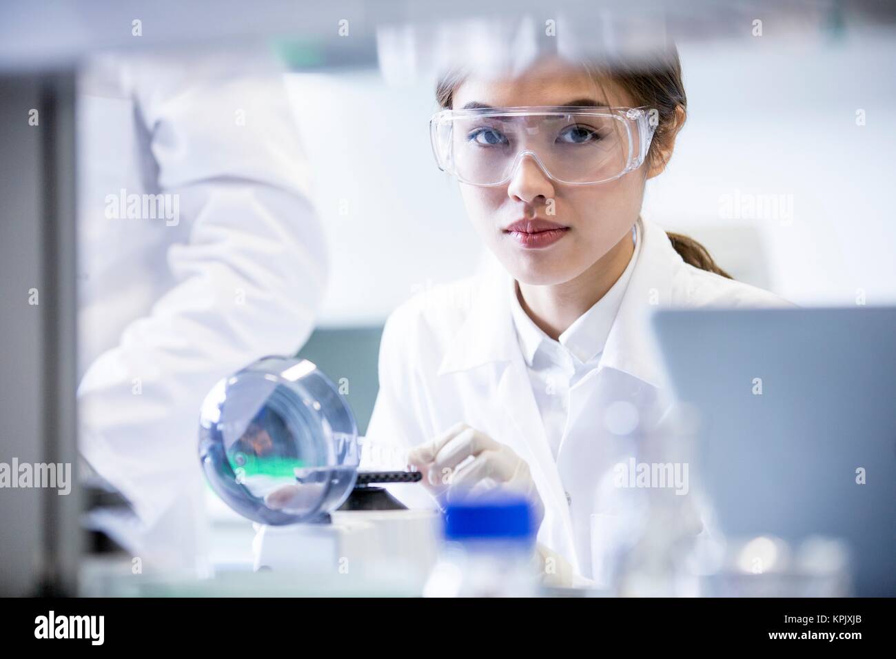 Female laboratory assistant using mini centrifuge Stock Photo Alamy