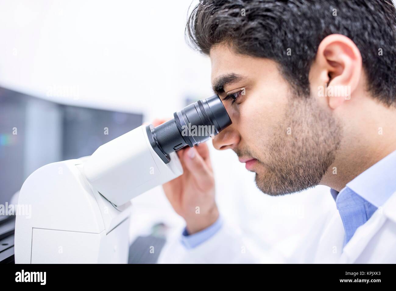 Male scientist using microscope, close up Stock Photo - Alamy