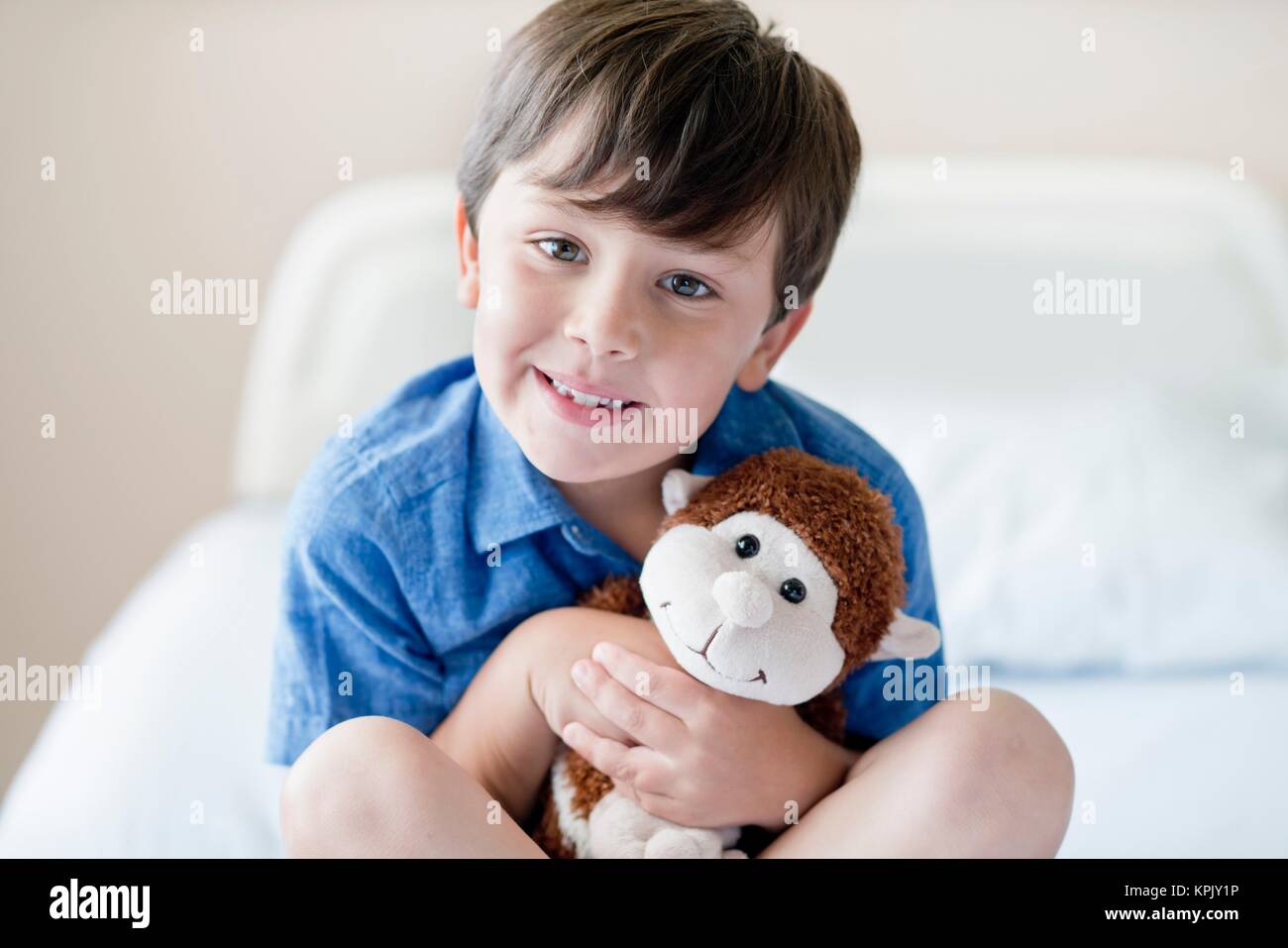 Young boy in hospital with teddy bear. Stock Photo