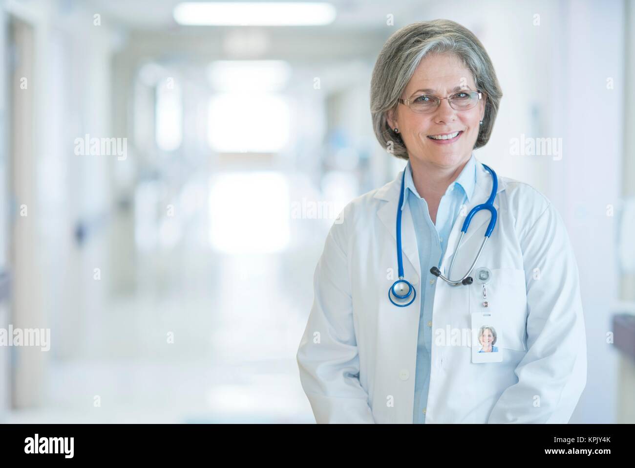 Mature female doctor smiling, portrait Stock Photo - Alamy
