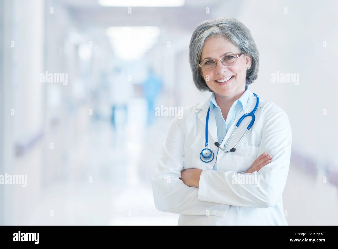 Mature female doctor smiling, portrait Stock Photo - Alamy