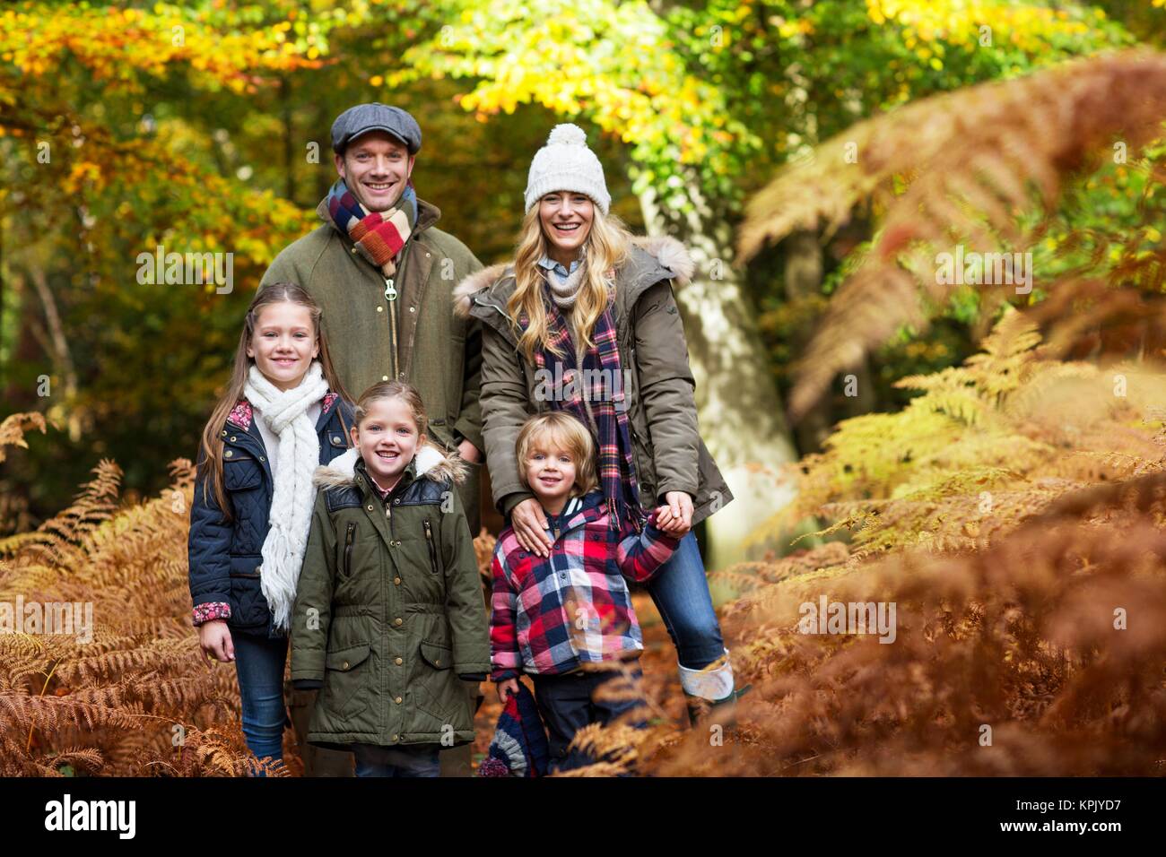 Family in woods in Autumn, portrait Stock Photo - Alamy