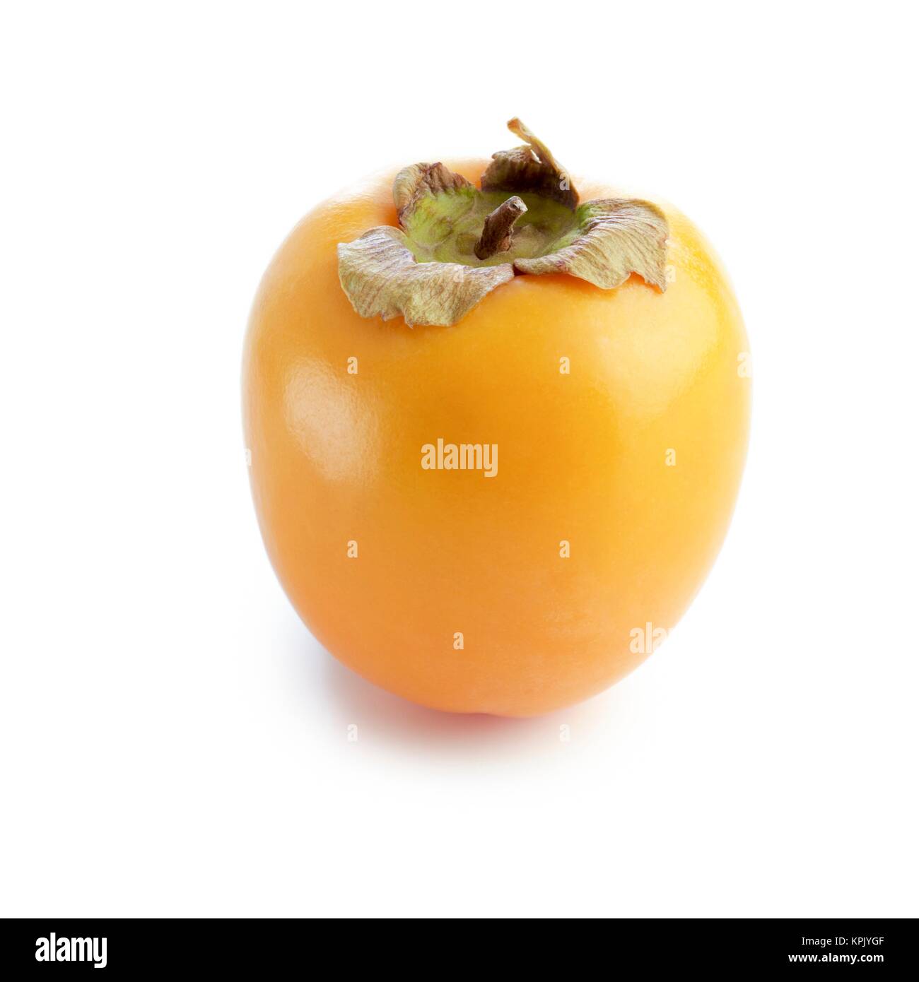 Sharon fruit against a white background Stock Photo - Alamy