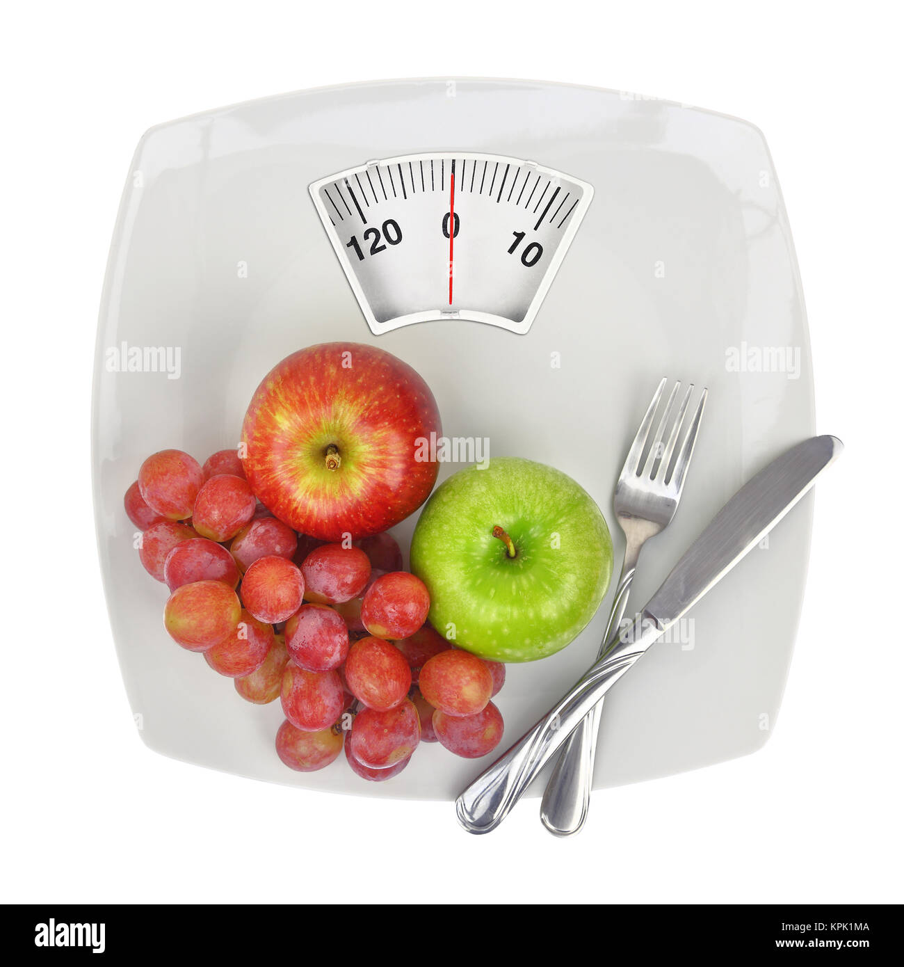 Fresh fruit on a plate with weighing scale Stock Photo