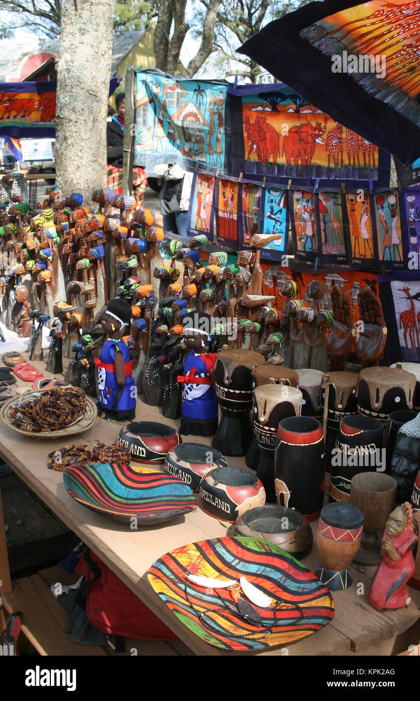 Hawker stall selling wooden carvings and sculptures on roadside
