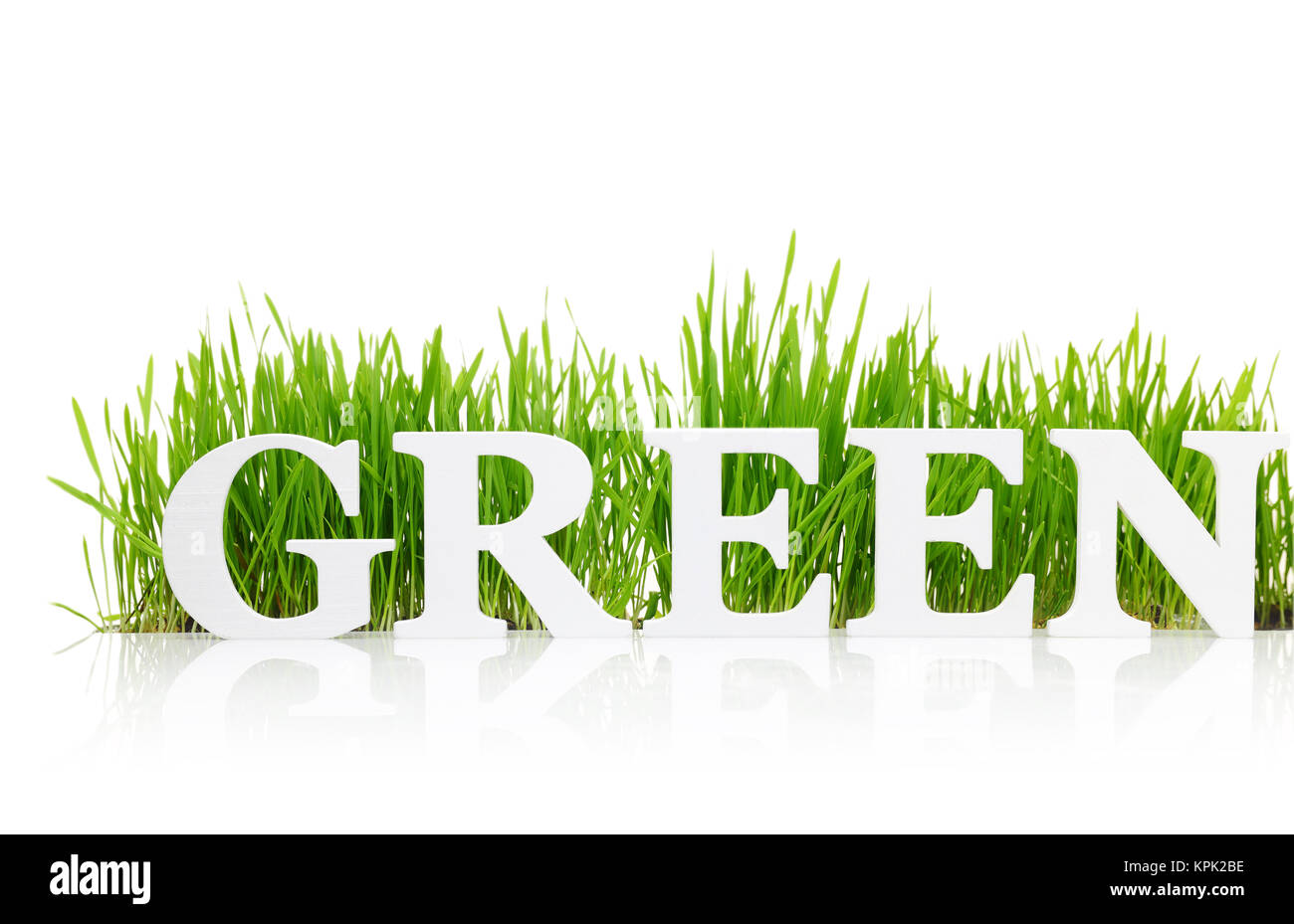 Word "Green" with fresh grass isolated on white Stock Photo