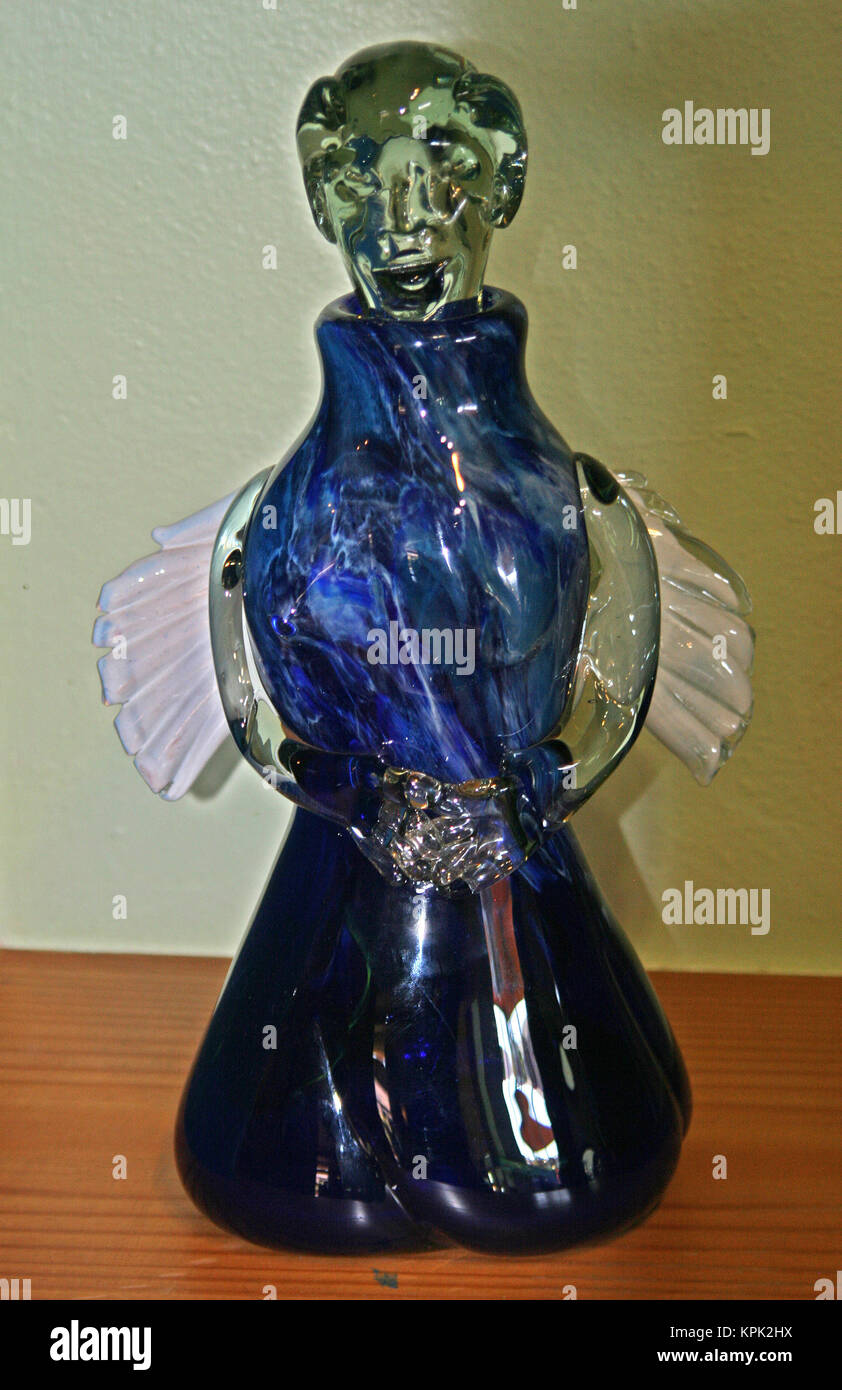 Display stand with blue angel handmade from recycled glass for sale, Kingdom of Swaziland. Stock Photo