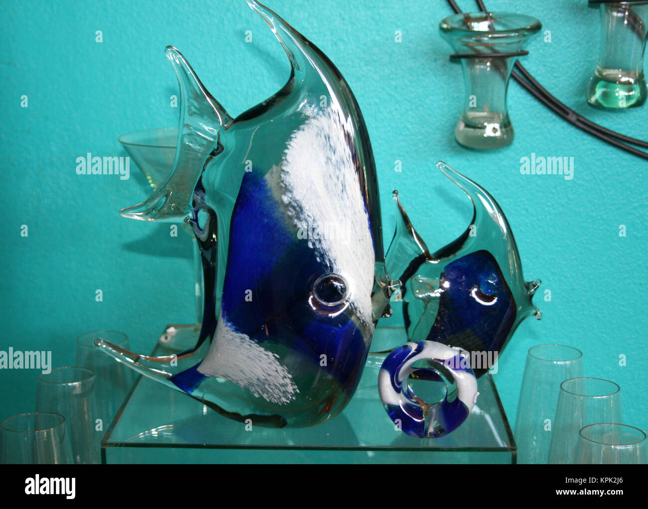 Display stand with blue angelfish handmade from recycled glass for sale, Kingdom of Swaziland. Stock Photo