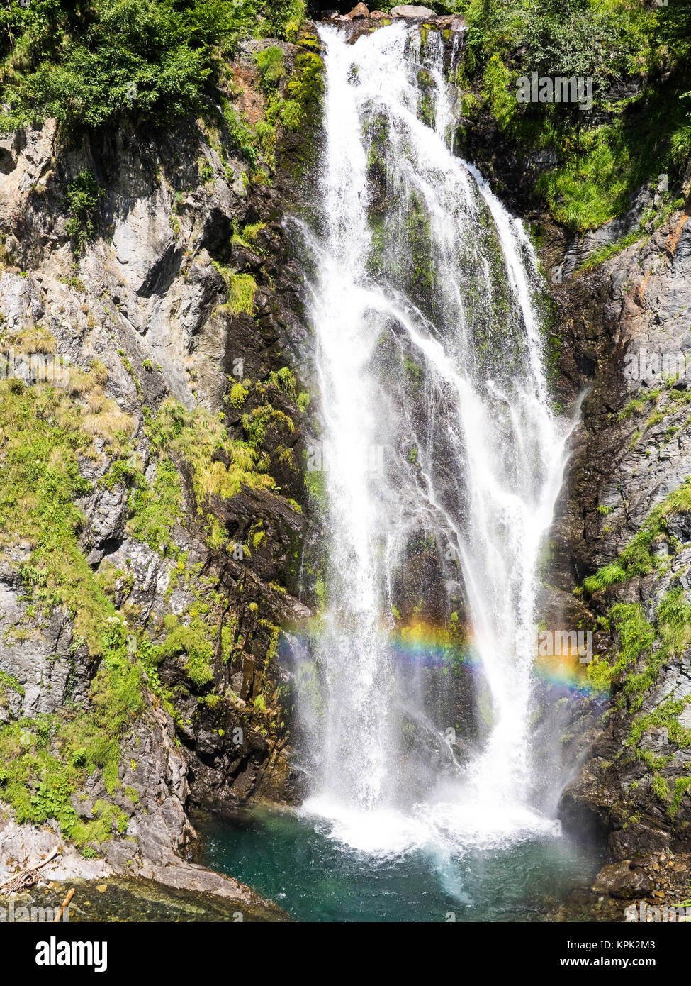 View of the rainbox colors in the Sauth des Pish waterfall in Aran