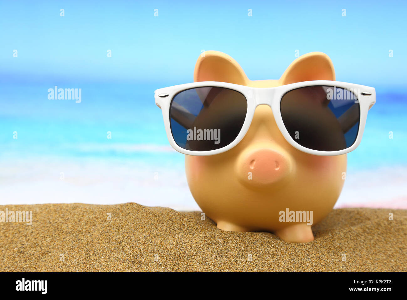 Summer piggy bank with sunglasses on the beach Stock Photo - Alamy