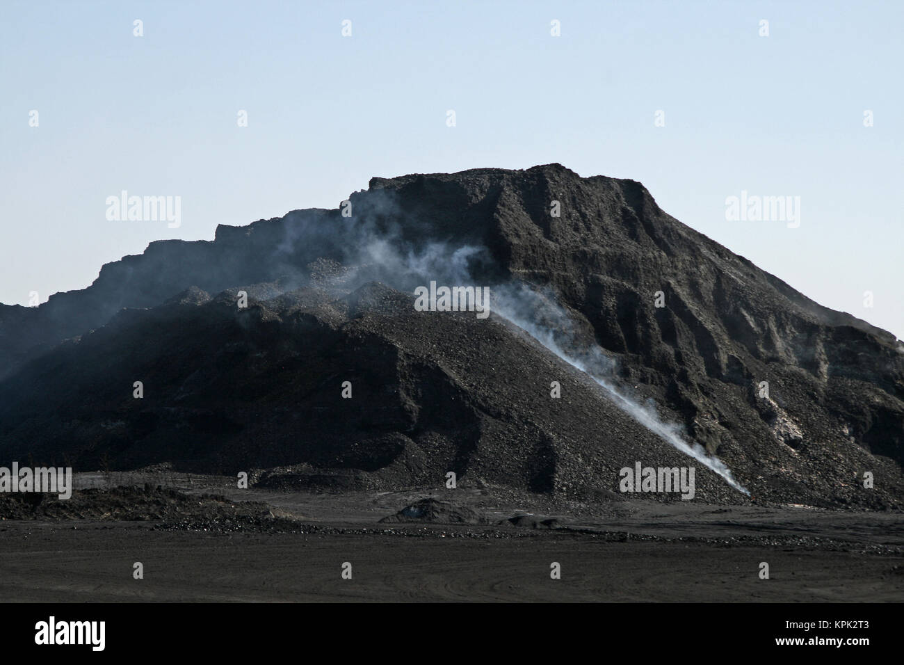 Countryside coal mine smoking, Kingdom of Swaziland. Stock Photo