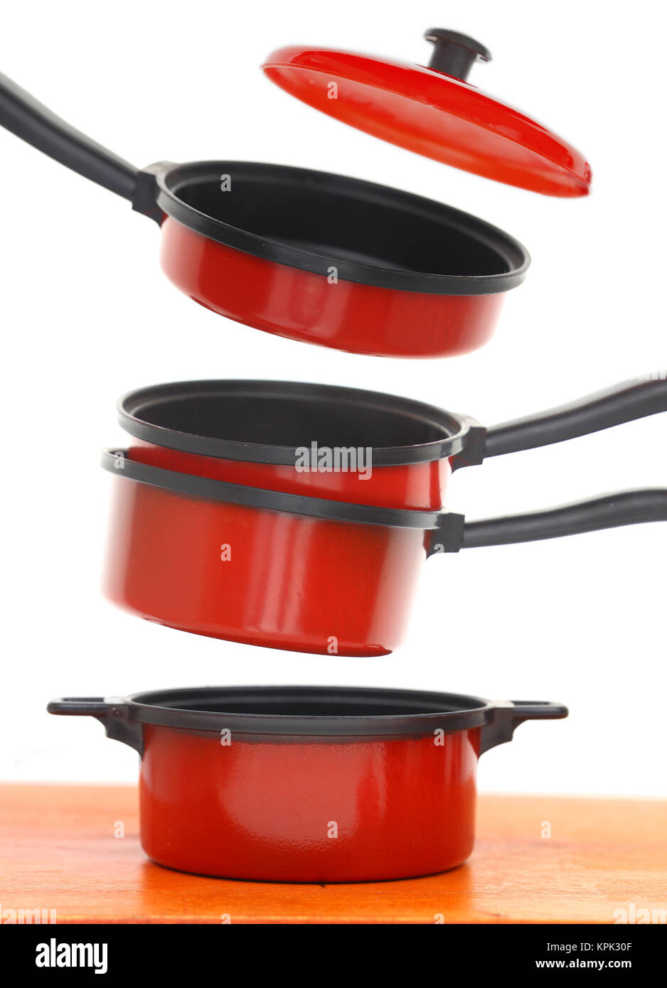 Red cookware set on white background Stock Photo