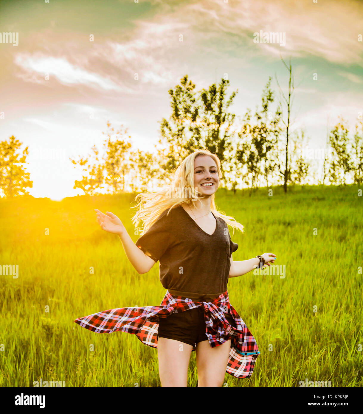 A Young Woman With Long Blond Hair Twirls And Runs Freely In A Grass Field In A Park Edmonton Alberta Canada Stock Photo Alamy A Young Woman With Long Blond Hair Twirls And Runs Freely In A Grass Field In A Park Edmonton Alberta Canada Stock Photo Alamy