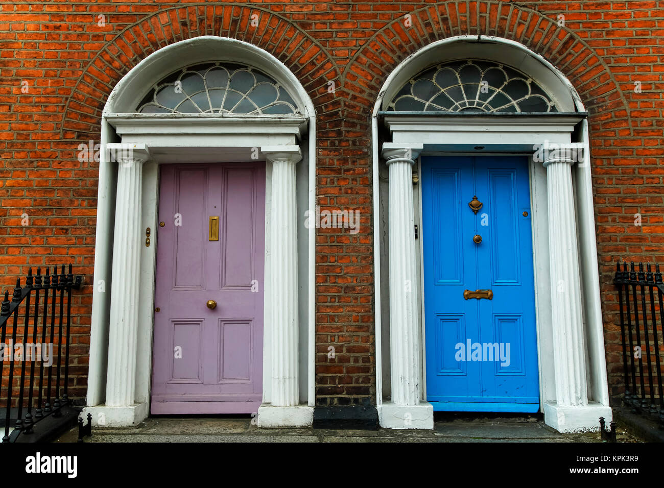 Georgian architecture and painted house doors with red brick facade in Dublin city centre; Dublin, Leinster, Ireland Stock Photo