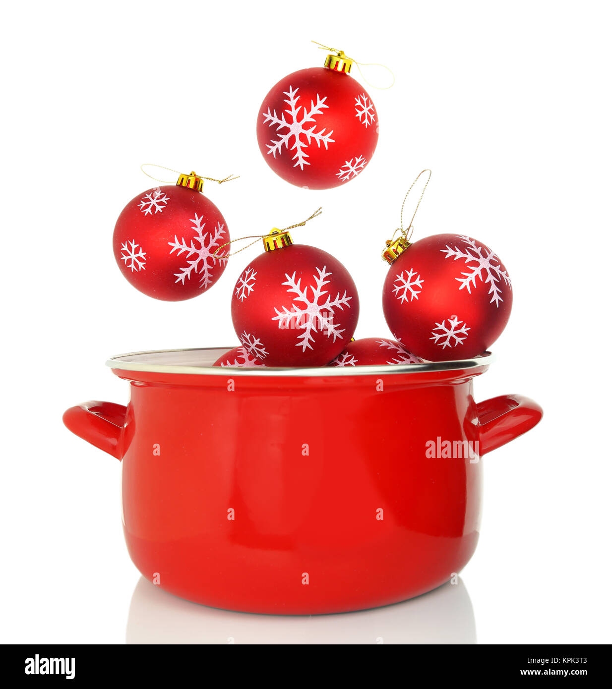 Red cooking pot with Christmas ornaments Stock Photo