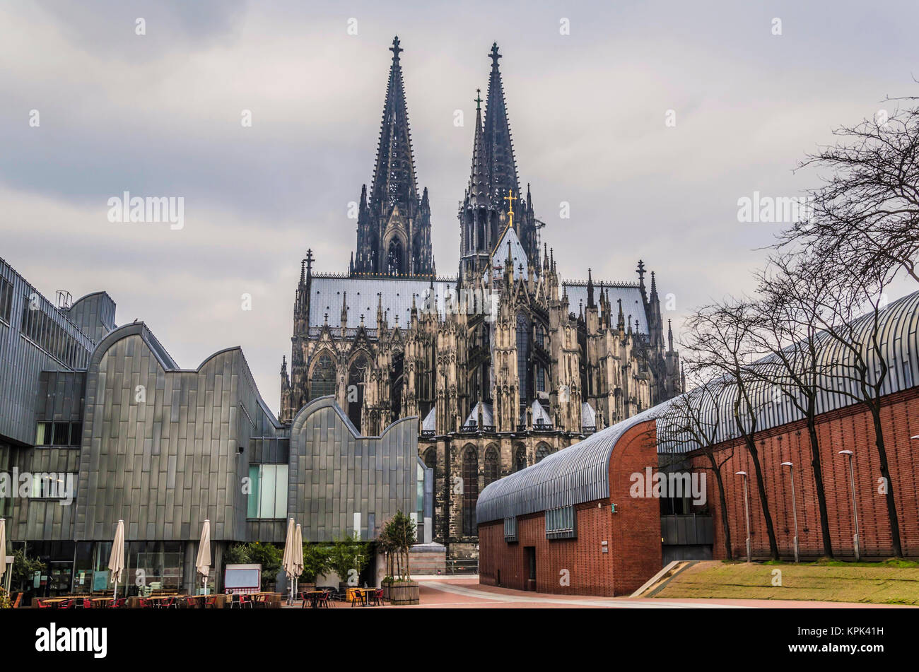 Shock of styles the Gothic of the German cathedral of Cologne dating to one thousand two hundred and forty-eight surrounded by modernist constructions Stock Photo