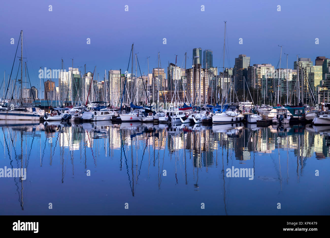 Skyline and harbour of Vancouver at twilight with reflections in the ...