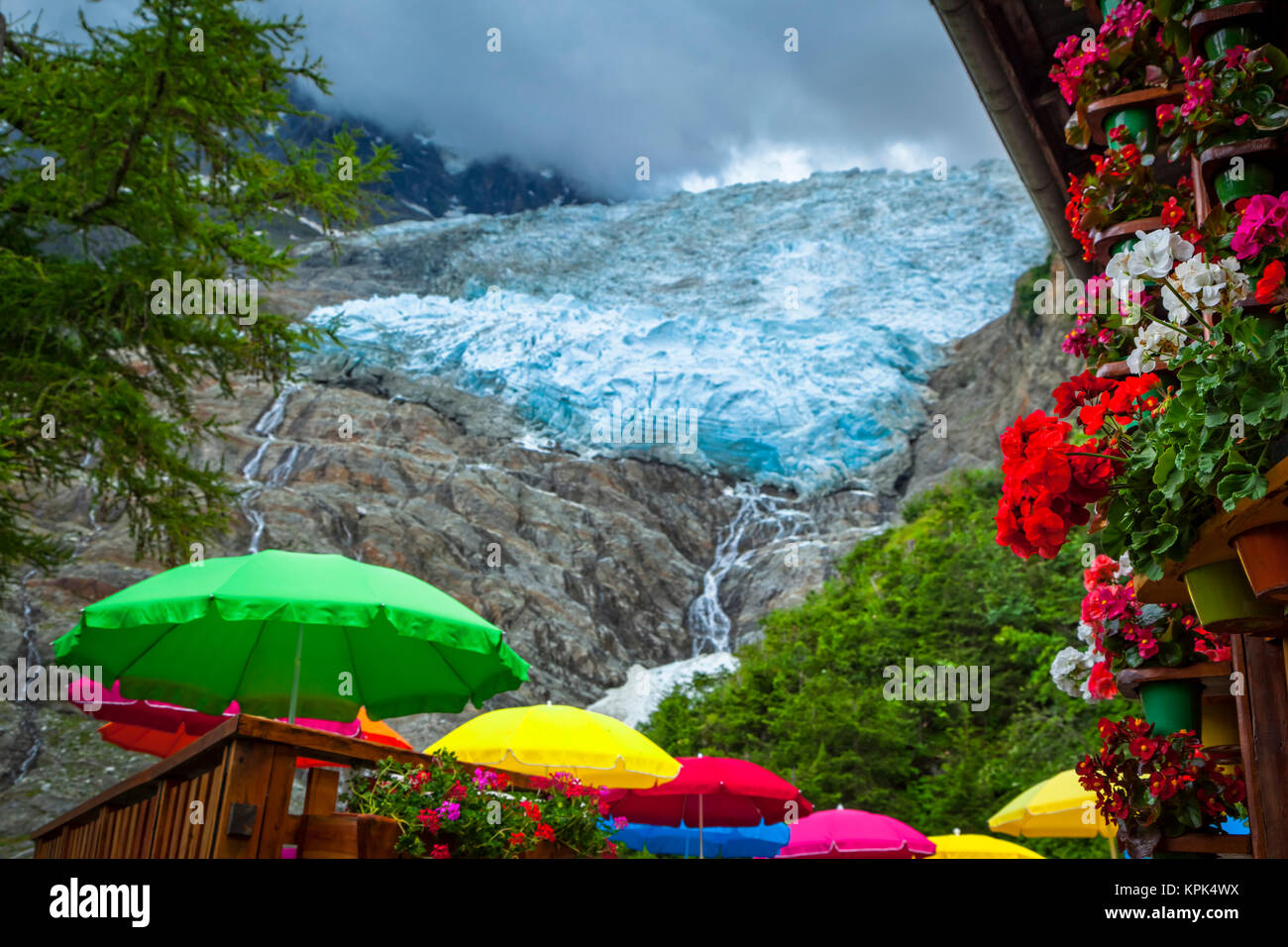 View of Bossons Glacier with colourful umbrellas and flowers from Chalet du  Glacier; Chamonix-Mont-Blanc, Haute-Savoie, France Stock Photo - Alamy