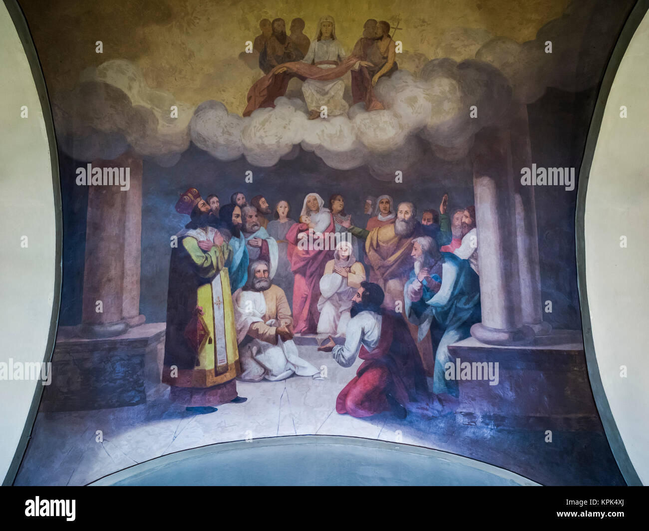 Christian Faith artwork depicting figures standing, kneeling and looking up to a cloud with Jesus and His followers with a cross Stock Photo