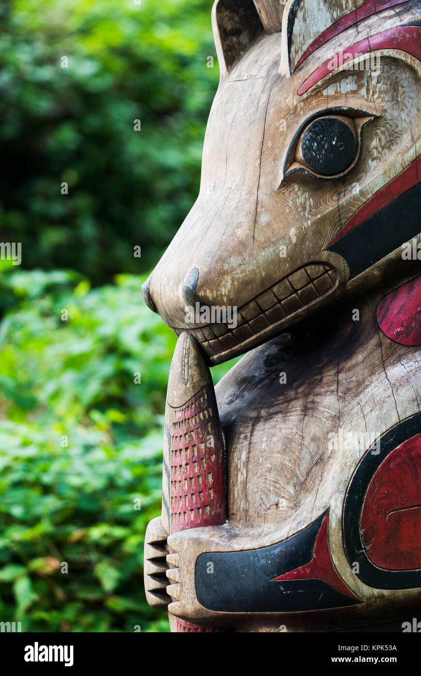 Close-up of a painted wooden indigenous sculpture of animal representation; Tofino, British Columbia, Canada Stock Photo