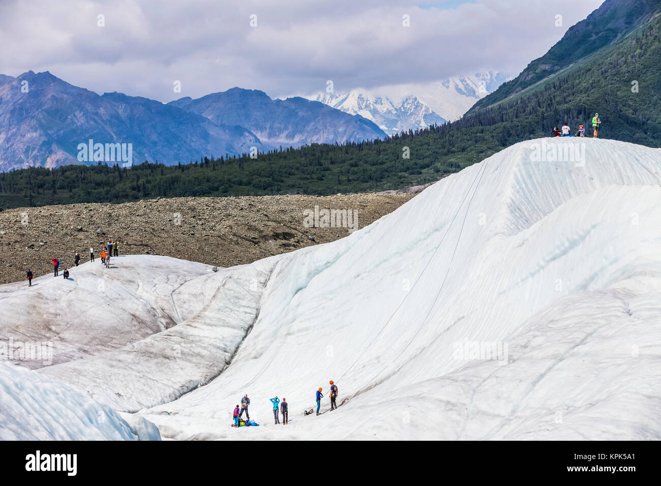 Guided groups recreate on Root Glacier in Wrangell-St. Elias National Park; Alaska, United States of America Stock Photo