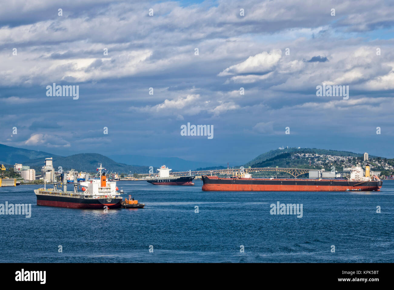 Cargo ships in the Vancouver harbour; Vancouver, British Columbia ...