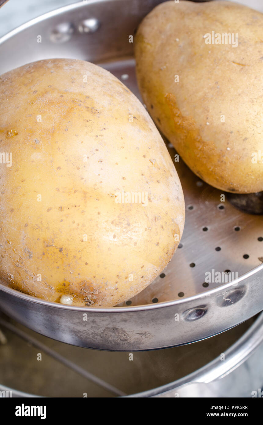 Whole potatoes steam boiled in a pressure cooker Stock Photo Alamy