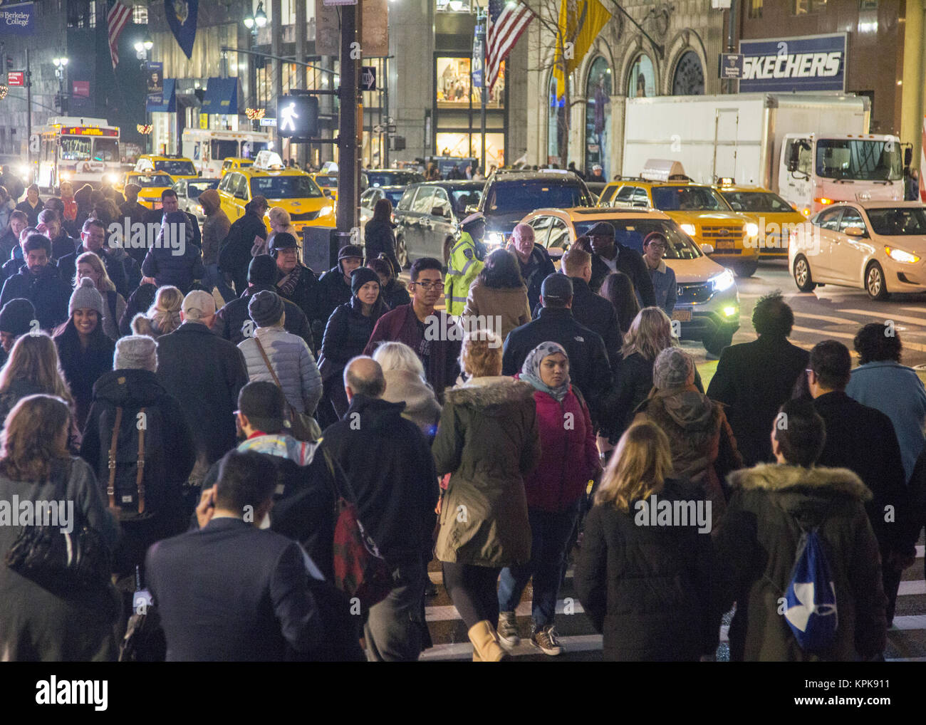 During the Christmas holiday season the streets of Manhattan are extra busy day and night. 5th Avenue at 42nd Street in midtown Manhattan, NYC. Stock Photo