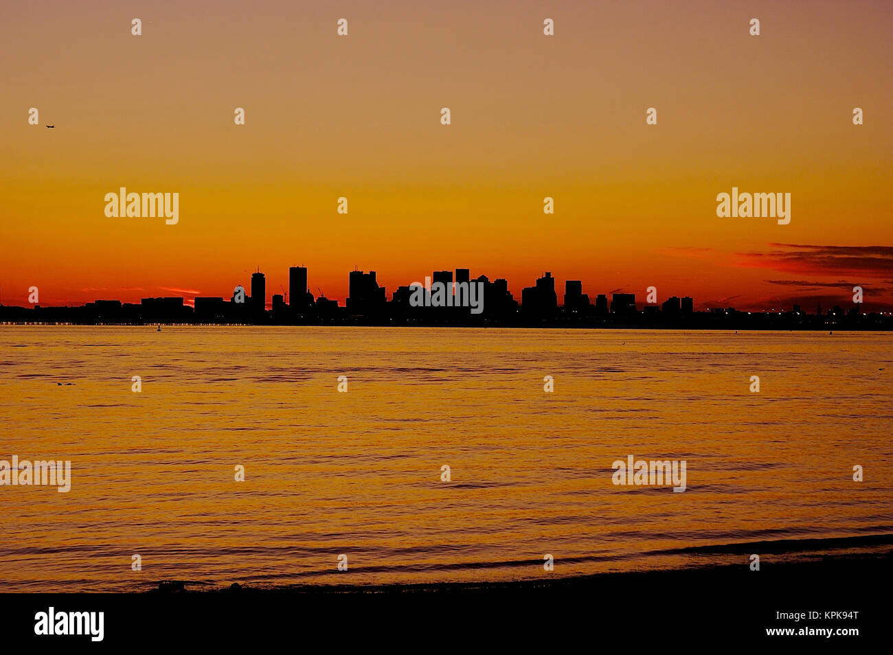 USA, Massachusetts. A sunset view of Boston from the shore in Winthrop. Stock Photo